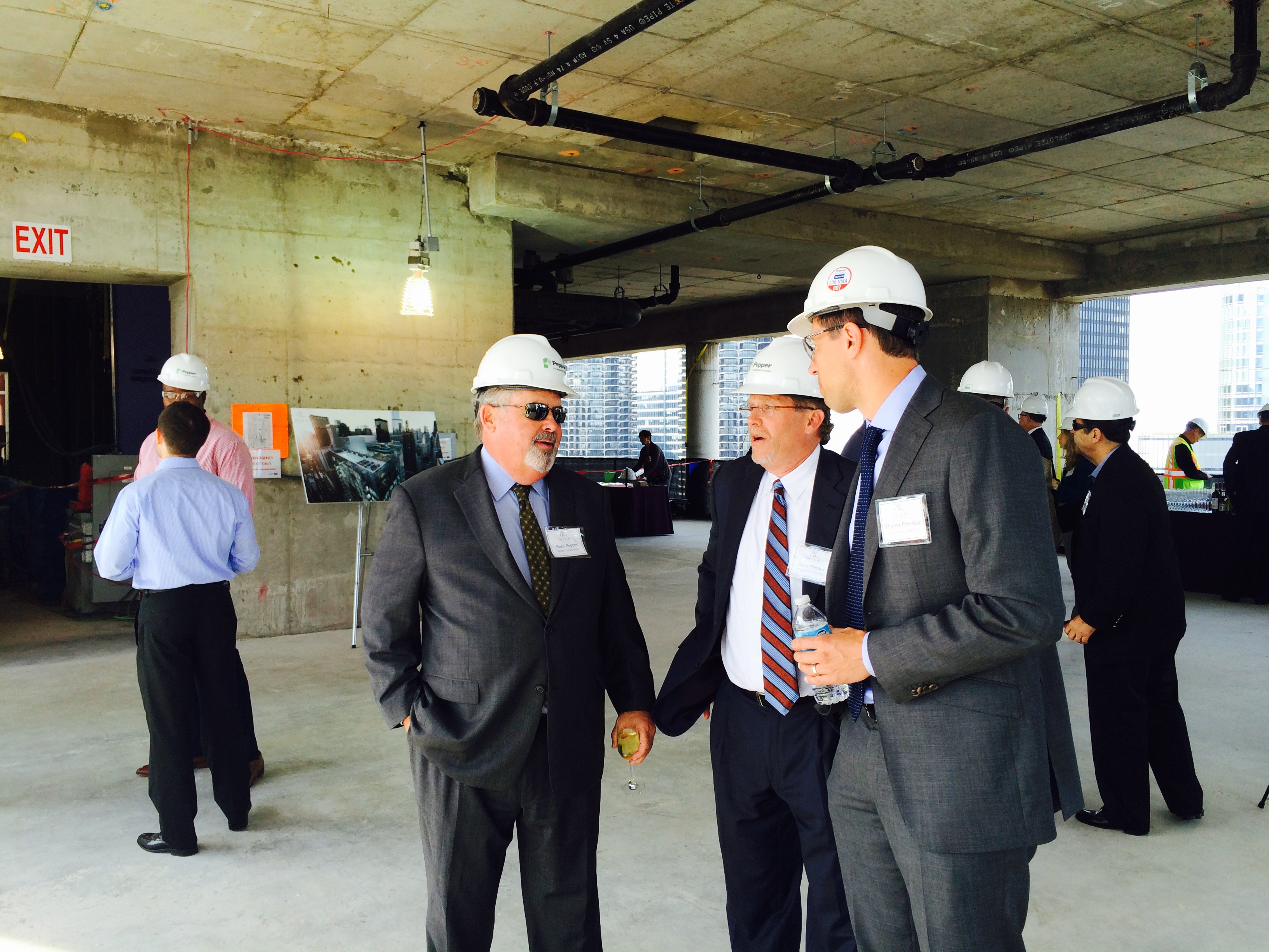 Scot Pepper and Stan Pepper at MILA topping out