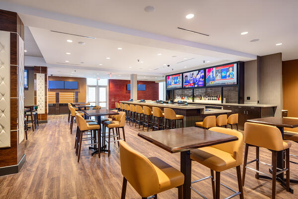 Renovated casino gaming space featuring a sportsbook, poker room, custom bar, and modern entertainment environment.