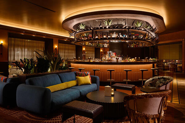 Toro restaurant at Chicago Fairmont Hotel featuring an open-flame kitchen, ceviche bar, warm wood finishes, and Latin-inspired dining atmosphere.