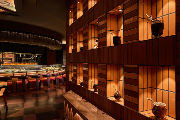 Toro restaurant at Chicago Fairmont Hotel featuring an open-flame kitchen, ceviche bar, warm wood finishes, and Latin-inspired dining atmosphere.