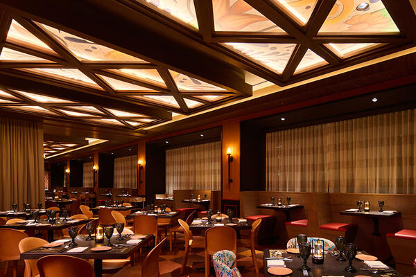 Toro restaurant at Chicago Fairmont Hotel featuring an open-flame kitchen, ceviche bar, warm wood finishes, and Latin-inspired dining atmosphere.