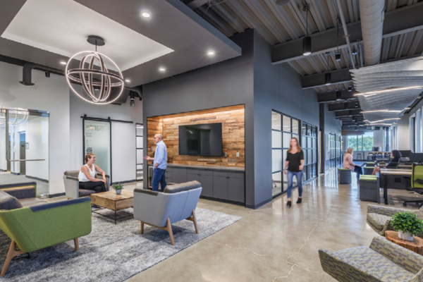 Custom finishes throughout like brick elements, polished concrete, 3D ceiling tile elements and lighting make the space their own.