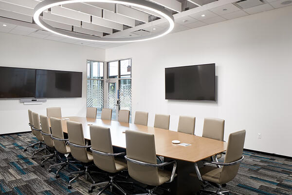 High ceilings and corner windows open up the meeting space.