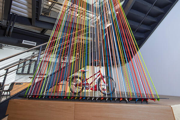 Artwork features outdoor activities connected to CLIF Bar's culture like rock-climbing and bicycling.