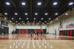 Students can train and compete in a new 60,000 square-foot fieldhouse equipped with a 200-meter indoor track and long-jump area, three basketball courts, batting cages, a weight room and fitness studio.