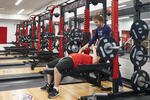 Students can train and compete in a new 60,000 square-foot fieldhouse equipped with a 200-meter indoor track and long-jump area, three basketball courts, batting cages, a weight room and fitness studio.