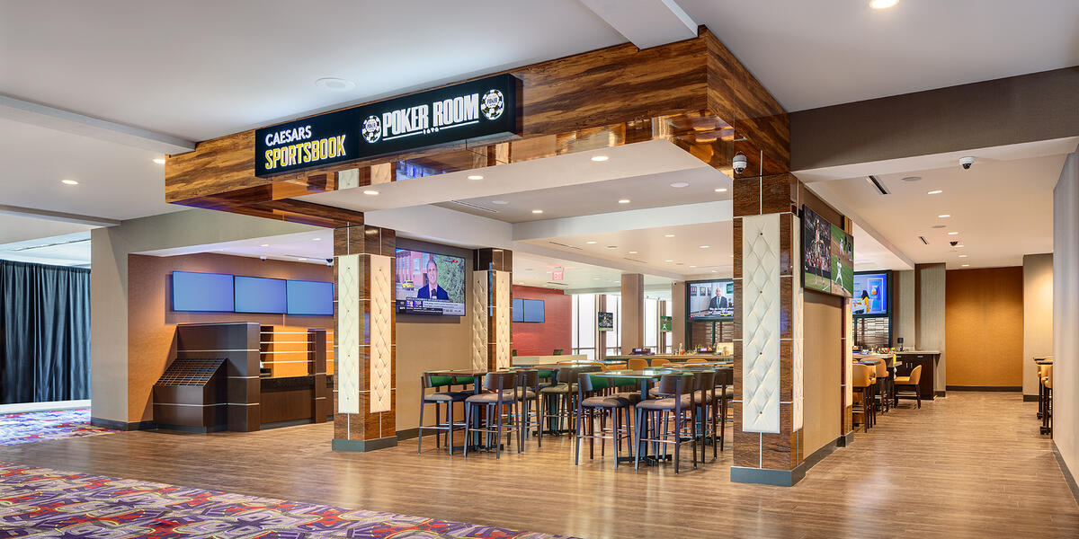 Modern sportsbook lounge at Grand Victoria Casino featuring gaming screens, betting stations, and contemporary hospitality finishes.