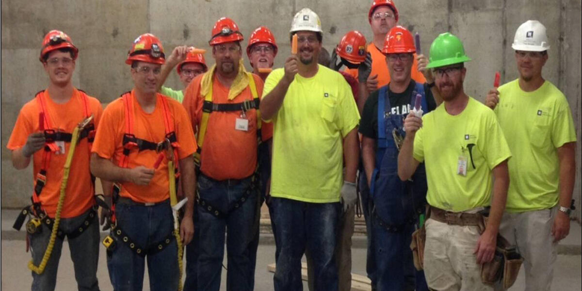 Tradespeople eating popsicles