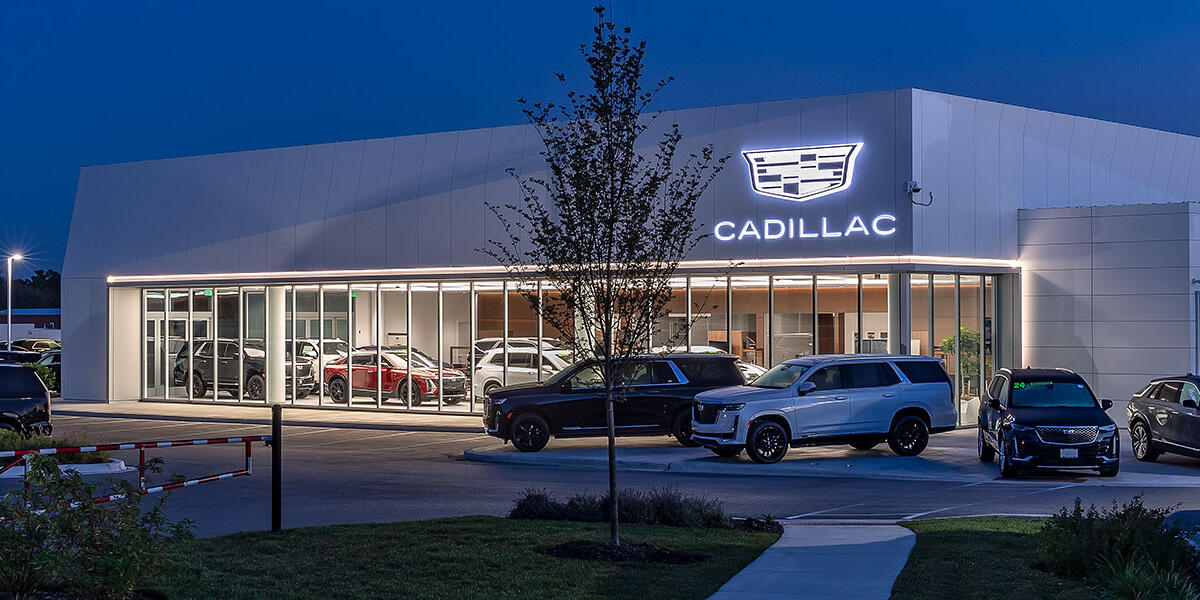 Cadillac showroom and service center for Motor Werks in Barrington, Illinois featuring modern dealership architecture and vehicle display areas.