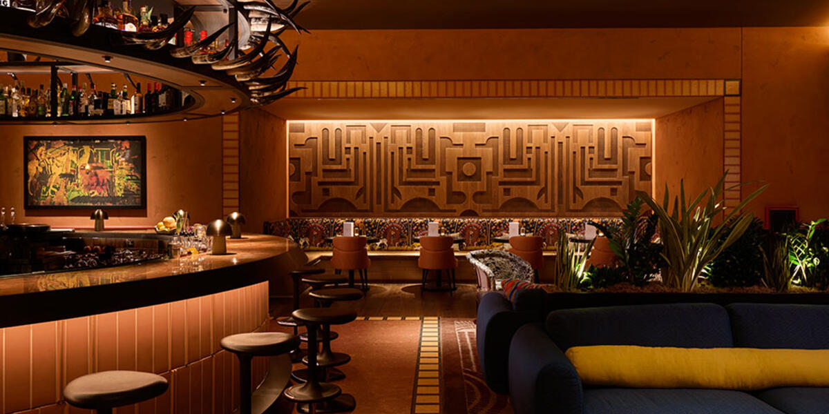 Toro restaurant at Chicago Fairmont Hotel featuring an open-flame kitchen, ceviche bar, warm wood finishes, and Latin-inspired dining atmosphere.