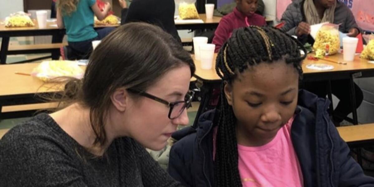 Pepper helps with holiday crafts at Genevieve Melody STEM School