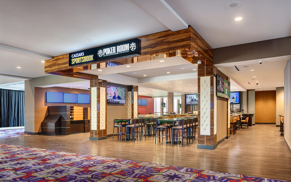 Modern sportsbook lounge at Grand Victoria Casino featuring gaming screens, betting stations, and contemporary hospitality finishes.