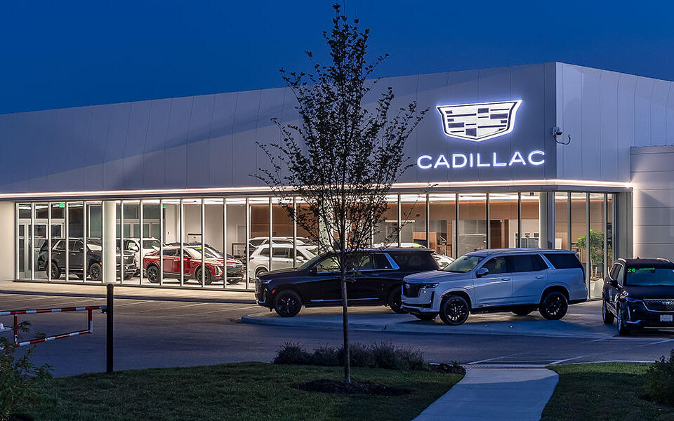 Cadillac showroom and service center for Motor Werks in Barrington, Illinois featuring modern dealership architecture and vehicle display areas.