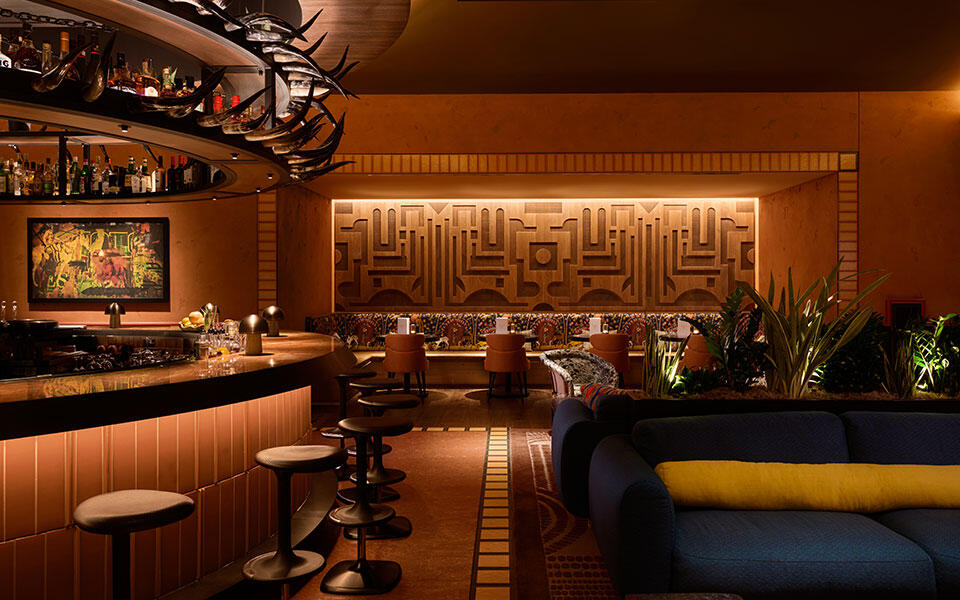 Toro restaurant at Chicago Fairmont Hotel featuring an open-flame kitchen, ceviche bar, warm wood finishes, and Latin-inspired dining atmosphere.